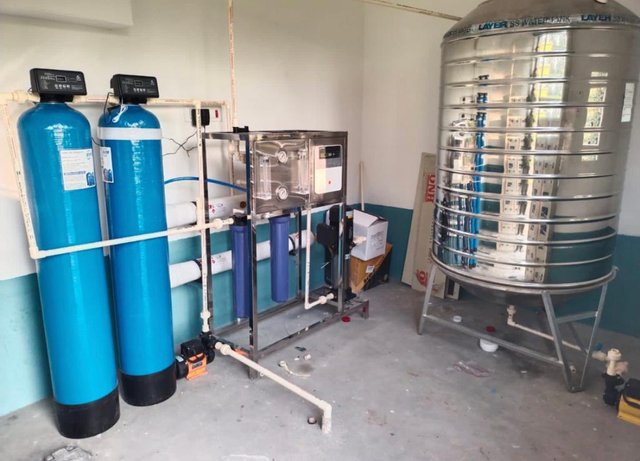 Commercial water purification system with RO filtration and steel storage tank — installed by Fix My Ware